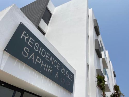 a sign on the side of a building at Étoile Harhoura in El Harhoura