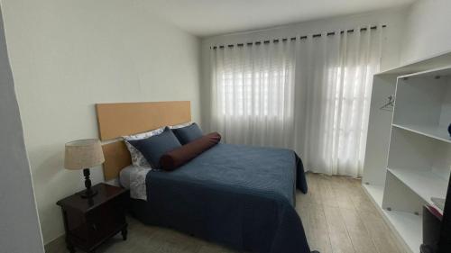 Un ou plusieurs lits dans un hébergement de l'établissement Casa da Marga · Próxima ao Centro · Casa Inteira