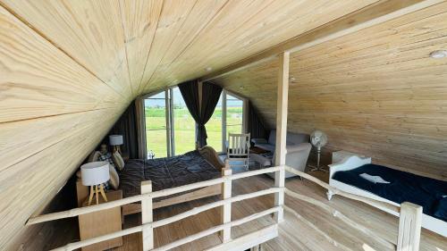 an overhead view of a bedroom in a log cabin at Saulėlydis in Dreverna