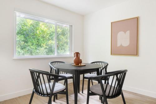 a table and chairs in a room with a window at Cupertino 2br w pool ac nr shops dining SFO-1437 in Cupertino