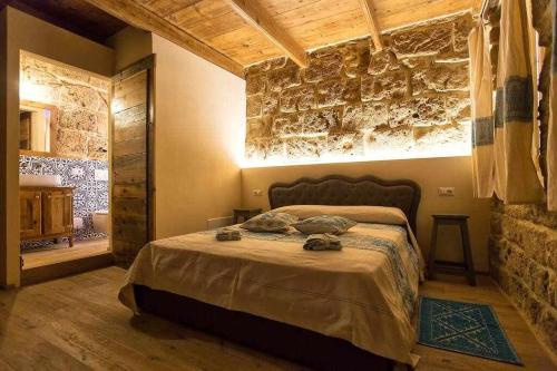 מיטה או מיטות בחדר ב-Grand Suite Gioberti Elegante nel cuore di Alghero