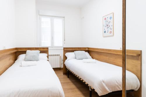 Katil atau katil-katil dalam bilik di Bonito y cómodo apartamento cerca de la playa
