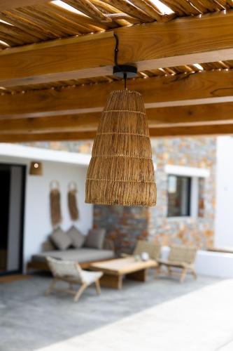 a living room with a couch and a table at The Nine Graces - Kastraki Villas with Private Swimming Pool in Kastraki Naxou