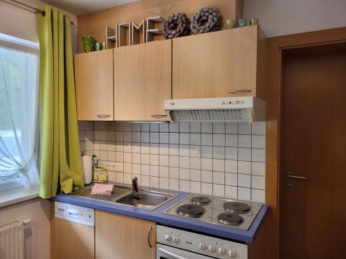 a kitchen with a sink and a stove at Apartment Michael - KPL634 by Interhome in Kappl