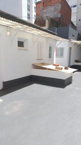 a view of a white building with a roof at La Casona-Departamentos in Mar del Plata