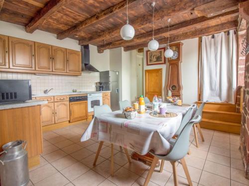 a kitchen with a table and chairs in a room at Holiday Home La Salesse by Interhome in Meyssac