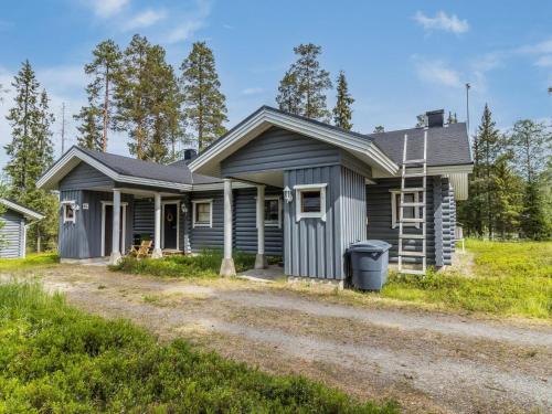 a house with a gravel driveway in front of it at Holiday Home Kaukonraitti 4 c 2 by Interhome in Ruka