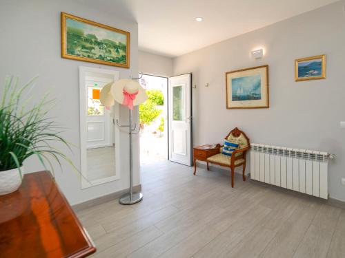a living room with a lamp and a chair at Holiday Home Alan by Interhome in Albir