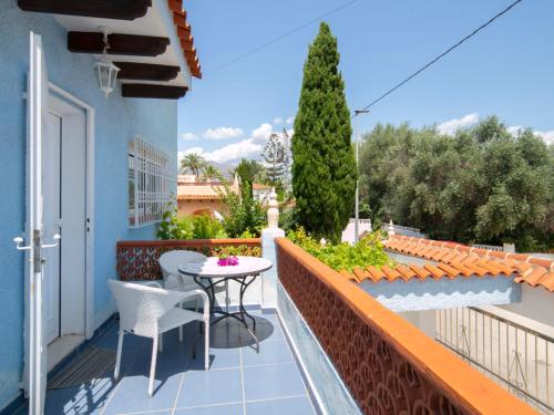a balcony with a table and chairs on a building at Holiday Home Alan by Interhome in Albir