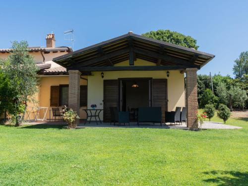 a patio with a roof over a yard at Holiday Home Rosa Tea by Interhome in Bolsena