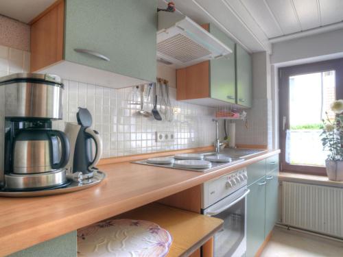 a kitchen with a coffee maker on a counter at Apartment Am Dohlenberg by Interhome in Schieder-Schwalenberg