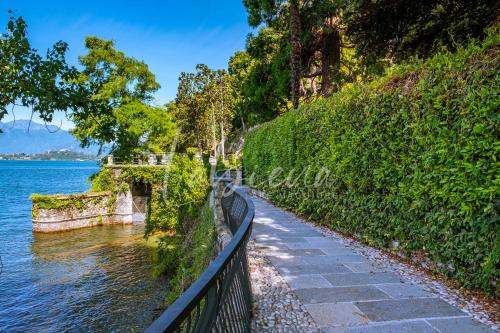 a walkway next to a body of water at Labiena Lake Maggiore in Laveno