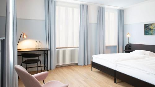 Postel nebo postele na pokoji v ubytování Hotel Schützen Rheinfelden