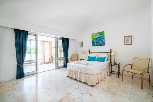 a bedroom with a bed with blue pillows at BeGuest Vale de Lobo 932 Villa in Almancil