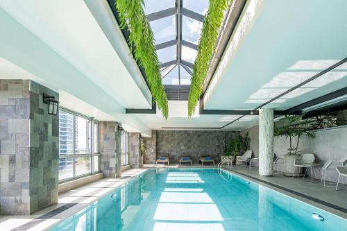 a swimming pool with a glass ceiling at Dusit Princess Hotel Residences Nairobi in Nairobi