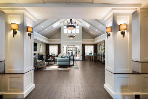 a lobby with columns and a living room at Sonesta ES Suites Orlando - Lake Buena Vista in Orlando