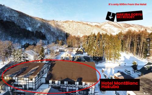 an aerial view of a hotel in the snow at Hotel Montblanc Hakuba in Hakuba