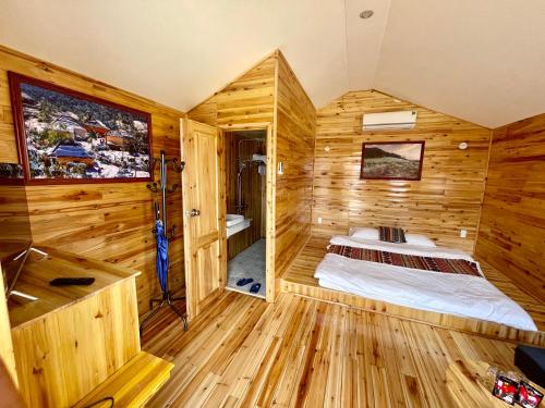 Ένα ή περισσότερα κρεβάτια σε δωμάτιο στο Homestay Thạch Gia Trang Sapa
