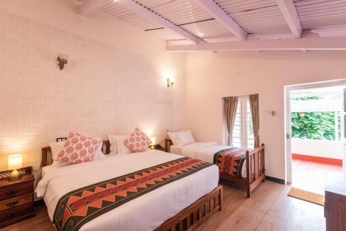 Postel nebo postele na pokoji v ubytování Ibex Resorts, Coonoor Leewood