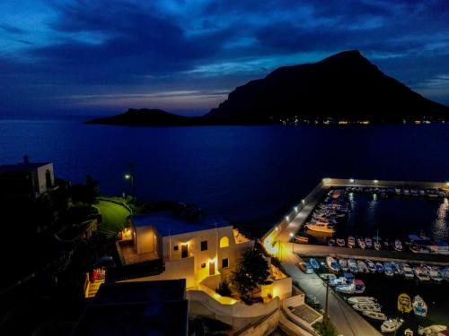 a view of a harbor at night with a marina at Pelagos Seafront Accommodation - George in Myrties