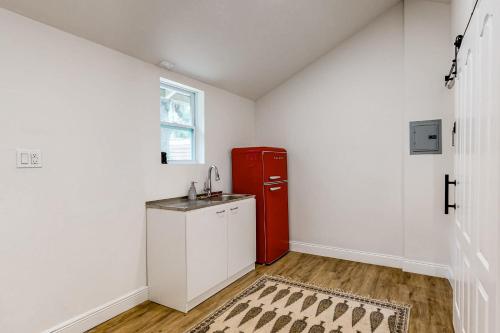 a kitchen with a red refrigerator in a room at Belleview Lakehouse in Ocklawaha