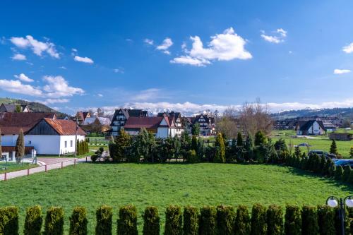 a view of a park with houses and trees at Parzenica B&B - Wyjątkowa i Jedyna!!! Sprawdź nas a nie pożałujesz! in Białka Tatrzanska