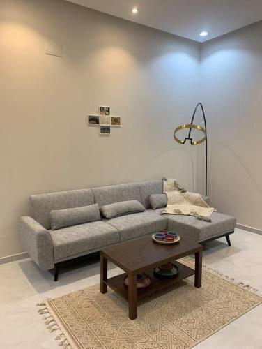 אזור ישיבה ב-Nirvana Luxury Apartments - Alqurayah شقة القُريَّة