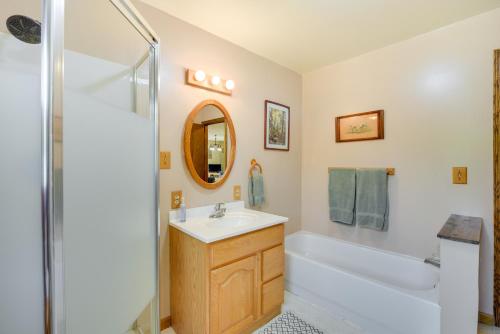 een badkamer met een wastafel, een bad en een douche bij South Range Home - 6 Mi to Lake Superior! in South Range