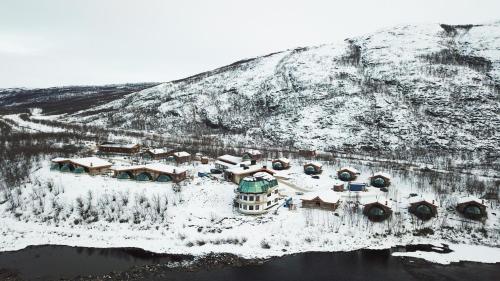 an aerial view of a resort in the snow at Utsjoki Arctic Resort in Utsjoki