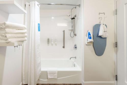 a white bathroom with a shower and a sink at Hampton Inn Columbia I-26/Harbison Blvd in Columbia