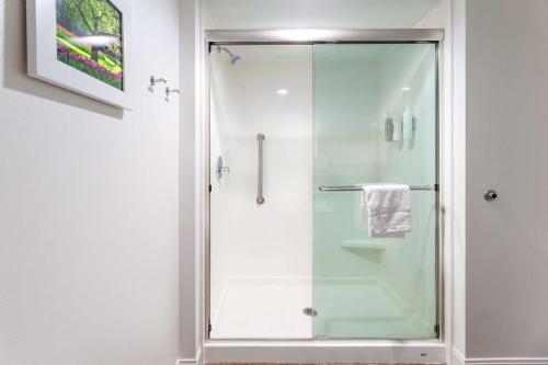 a shower with a glass door in a bathroom at Hampton Inn Columbia I-26/Harbison Blvd in Columbia