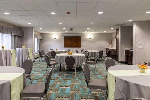 a conference room with tables and chairs and a podium at Hampton Inn Columbia I-26/Harbison Blvd in Columbia