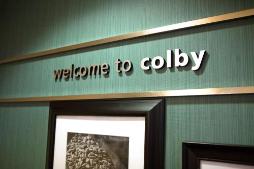a welcome tolly sign on a wall above a door at Hampton Inn Colby in Colby