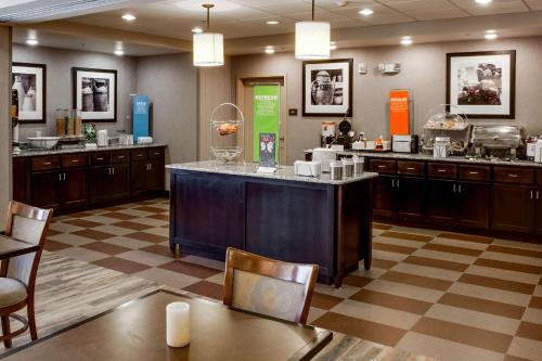 a kitchen with a large island in a room at Hampton Inn Chickasha in Chickasha