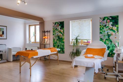 a hospital room with two beds and a window at Erzgebirgshotel Freiberger Höhe in Eppendorf