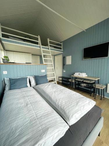 Un pat sau paturi într-o cameră la Amma Jóna