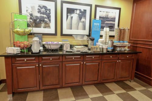 a kitchen with a counter with some food on it at Hampton Inn Lincolnton in Lincolnton
