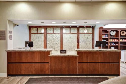 a lobby with a reception desk in a hospital at Homewood Suites by Hilton Tampa-Port Richey in Port Richey