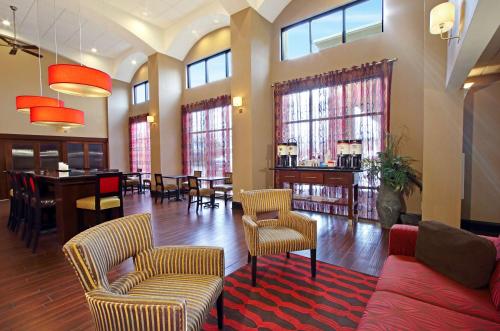 a living room with a couch and chairs and a table at Hampton Inn & Suites Columbus Hilliard in Hilliard