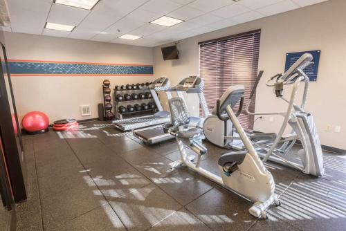 a gym with several cardio machines in a room at Hampton Inn & Suites Tilton in Tilton