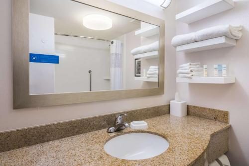 a bathroom with a sink and a mirror at Hampton Inn Clifton Park in Clifton Park