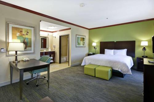 a hotel room with a bed and a desk at Hampton Inn & Suites Corpus Christi I-37 - Navigation Boulevard in Corpus Christi