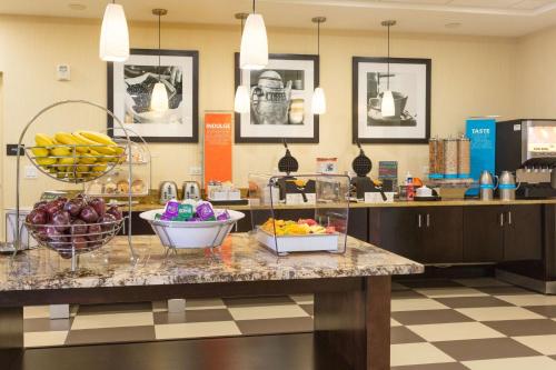 a lobby with a counter with fruit on it at Hampton Inn Daytona Beach/Beachfront in Daytona Beach