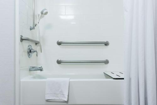 a white bathroom with a sink and a shower curtain at Hampton Inn Brooksville Dade City in Ridge Manor