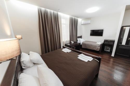 Katil atau katil-katil dalam bilik di Dvin Hotel