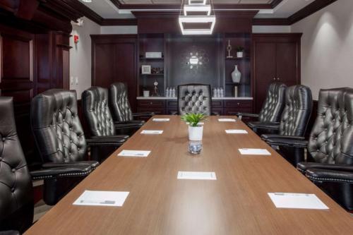 a conference room with a long table and chairs at Hampton Inn & Suites Dallas DFW Airport North Grapevine in Grapevine