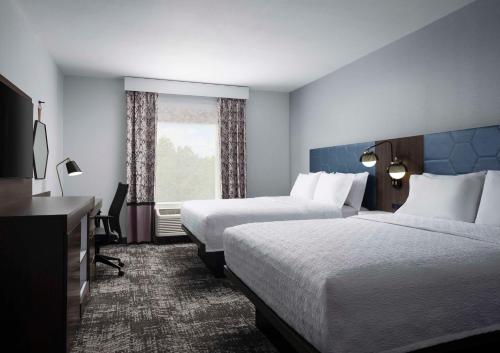 Letto o letti in una camera di Hampton Inn & Suites Dallas-DFW Airport Hurst