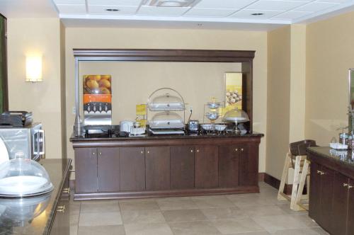 a kitchen with a counter with some food on it at Hampton Inn & Suites Dayton-Airport in Englewood