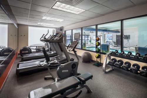 a gym with treadmills and ellipticals in a building at Hampton Inn Denver-West/Golden in Golden