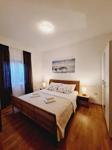 A bed or beds in a room at Apartman Marin - Zadar